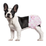 French Bulldog wearing Dono disposable female dog diaper in pink cute pattern, side view on white background, showing secure fit for Medium size dogs