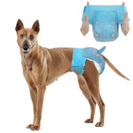 Thai Ridgeback wearing Dono disposable female dog diaper in blue denim pattern, XL size, with inset showing hands stretching open the diaper to display elastic waistband and tail hole, on white background