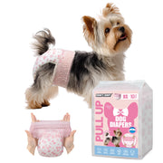 Yorkshire Terrier wearing Dono's Diary Pull Up female dog diaper in pink floral print, side view with tongue out; hands stretching open pink floral pull-up diaper showing elastic waistband; Dono's Diary Pull Up Dog Diapers XS 10pcs packaging, on white background