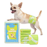 Chihuahua standing on hind legs wearing Dono's Diary male dog wrap diaper in green tennis ball print, with blue XS 60-count packaging and stack of folded diapers, on white background