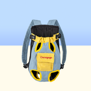 DONOYOYO pet carrier backpack in blue denim and yellow, front view showing padded leg holes, quick-release buckles, adjustable shoulder straps, and branded front pocket